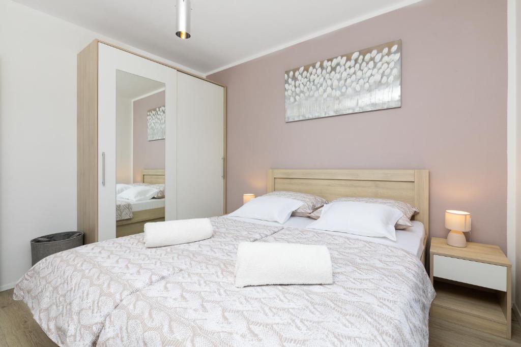 Postel nebo postele na pokoji v ubytování Apartman Bura
