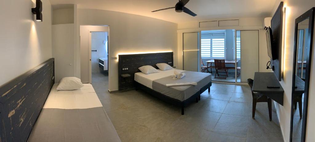 Postel nebo postele na pokoji v ubytování Karaibes Residence