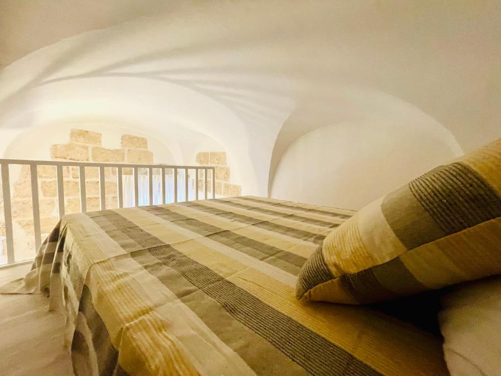 Postel nebo postele na pokoji v ubytování WHITE STONE- La Terrazza