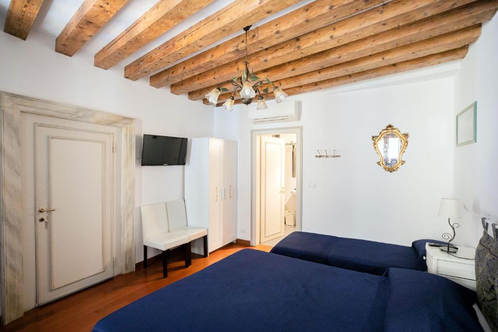 Postel nebo postele na pokoji v ubytování Hidden Gem in Venice