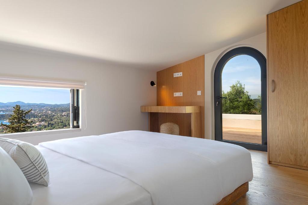 Postel nebo postele na pokoji v ubytování Greenstone Villas