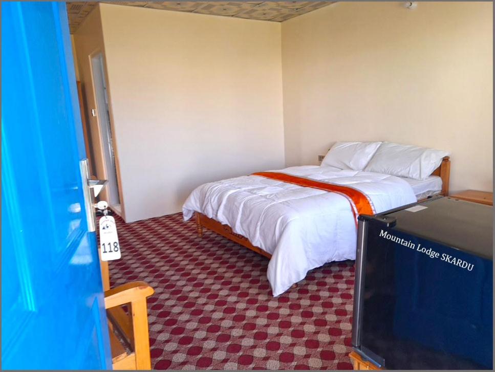 Voodi või voodid majutusasutuse Hotel Mountain Lodge Skardu toas