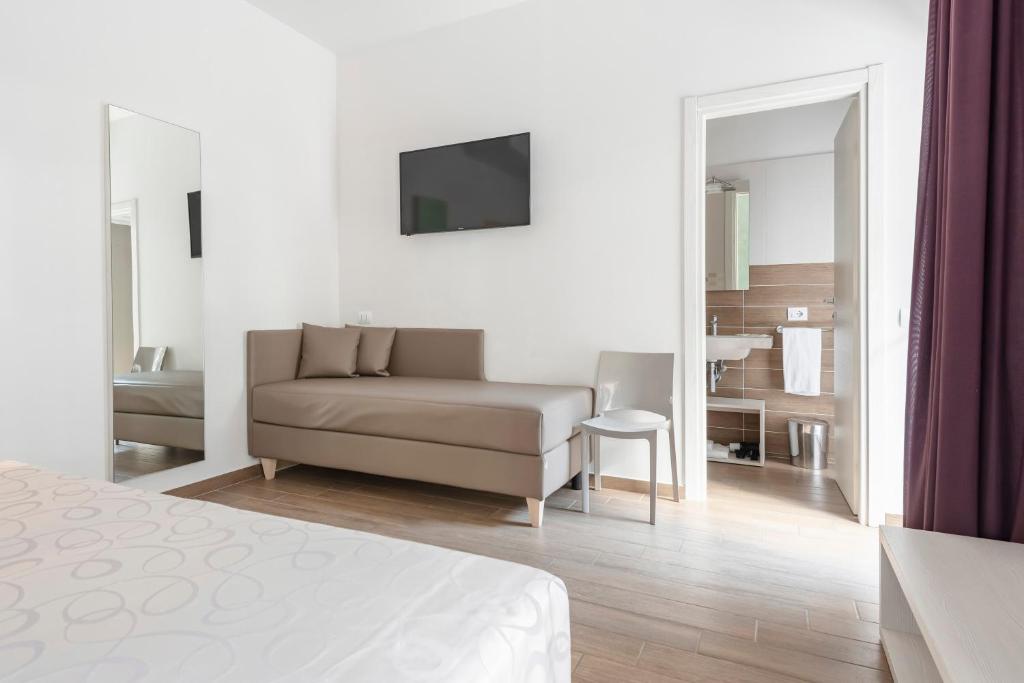 Postel nebo postele na pokoji v ubytování Hotel La Pineta