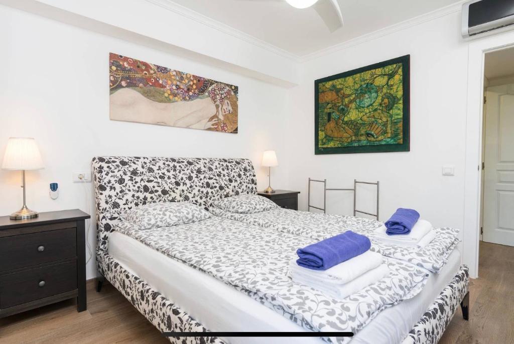 A bed or beds in a room at BEACH INN Apartment