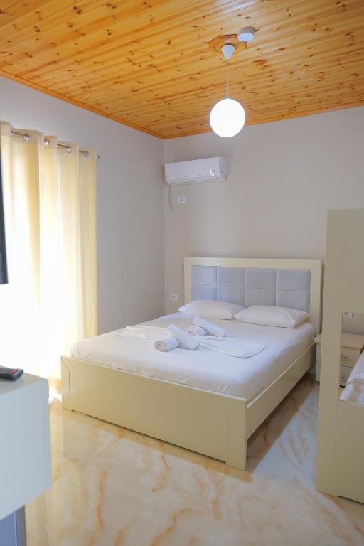 Postel nebo postele na pokoji v ubytování Vila Balani