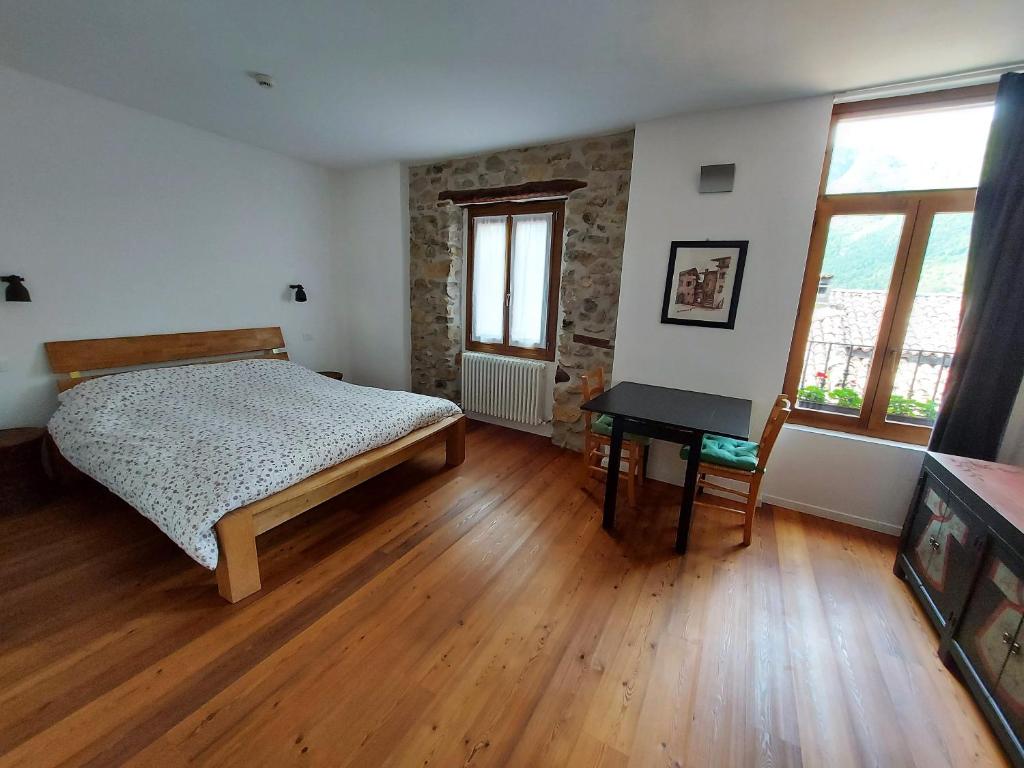 Postel nebo postele na pokoji v ubytování La Piazzetta di Canale B&B