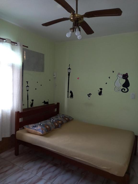 Postel nebo postele na pokoji v ubytování Pousada dos Mestres