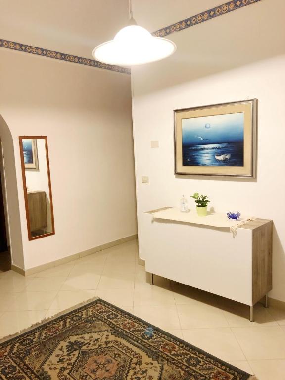 Televízia a/alebo spoločenská miestnosť v ubytovaní Apartment for 2 in Catania, B&B Le voci del mercato