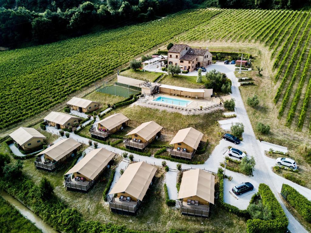an aerial view of a house in a vineyard at VillaLaDiva Boutique Glamping in Massignano