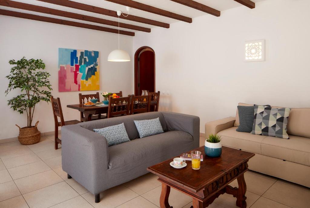a living room with a couch and a table at Apartments in Albufeira - Old Town in Albufeira