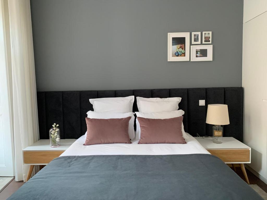 Postel nebo postele na pokoji v ubytování Pharmacia GuestHouse