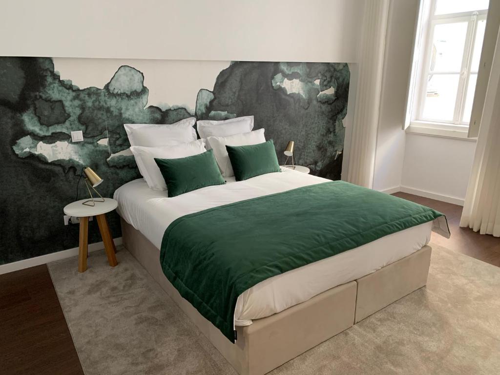 Postel nebo postele na pokoji v ubytování Pharmacia GuestHouse