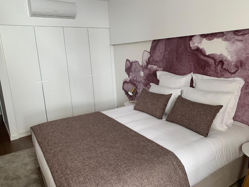 Postel nebo postele na pokoji v ubytování Pharmacia GuestHouse