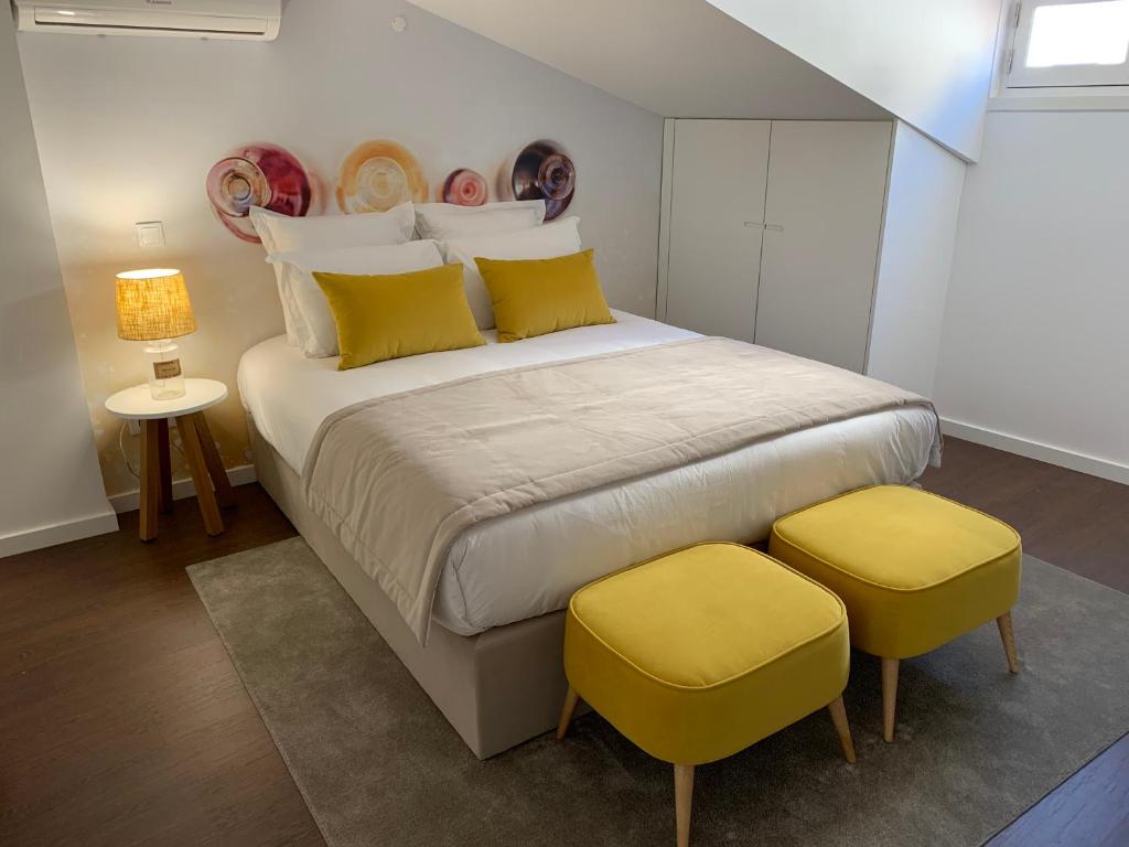 Postel nebo postele na pokoji v ubytování Pharmacia GuestHouse