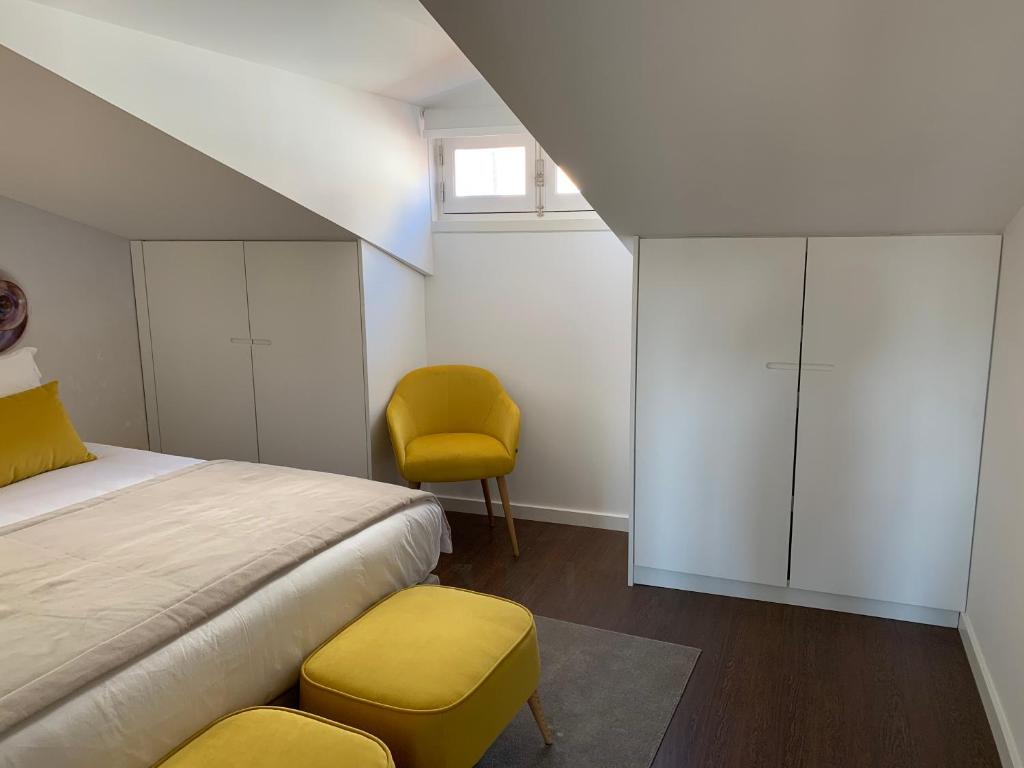 Postel nebo postele na pokoji v ubytování Pharmacia GuestHouse