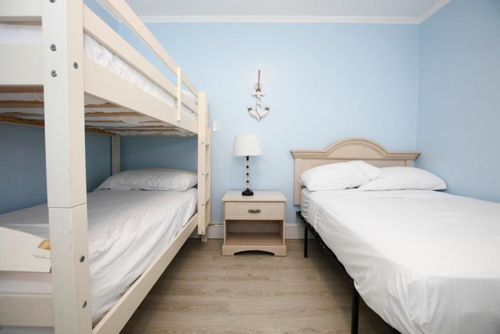Postel nebo postele na pokoji v ubytování Garfield Beach House