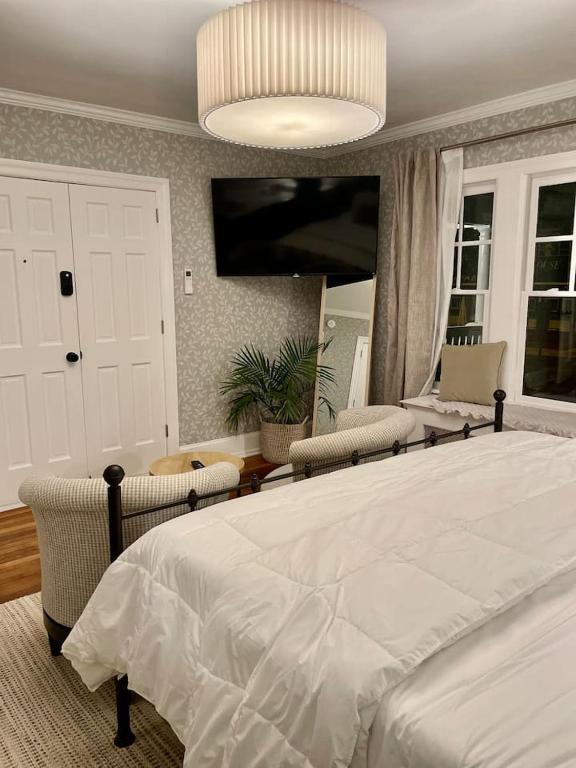 Postel nebo postele na pokoji v ubytování Buttonwood Boutique Hotel