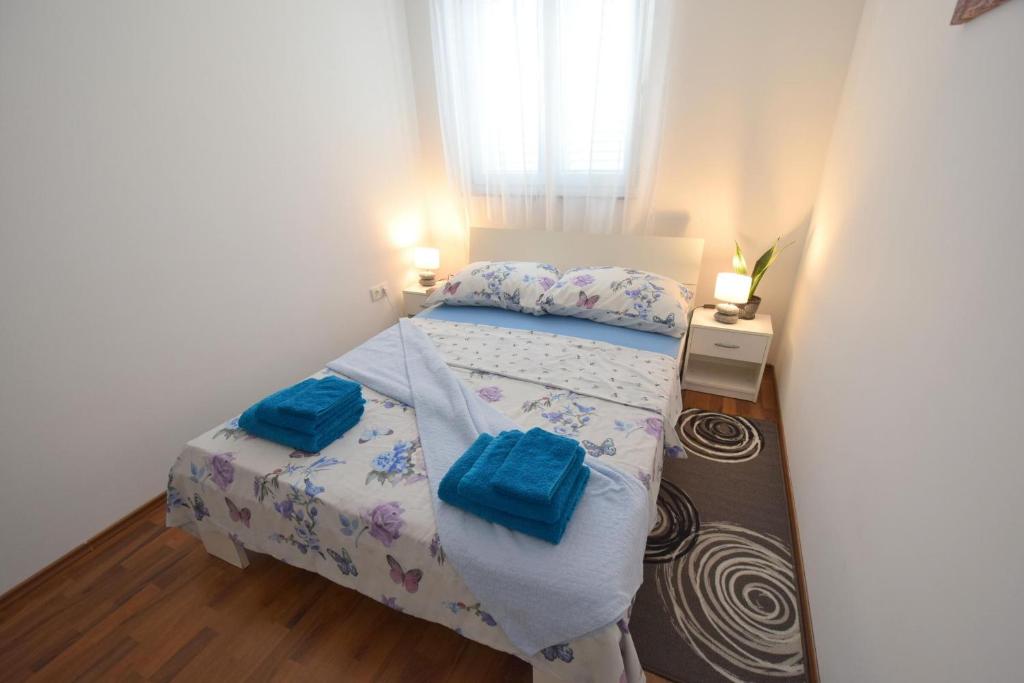 Postel nebo postele na pokoji v ubytování Apartment Gem
