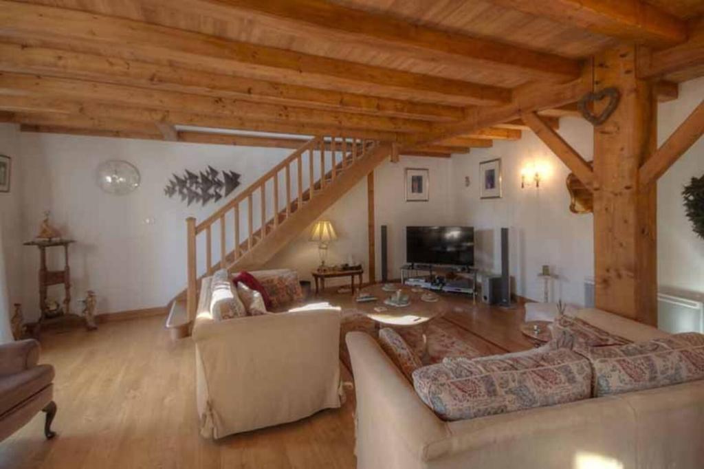 a living room with two couches and a staircase at 4Bed3Bath 1736 Farmhouse Barn Conversion-Hearth in Sainte-Soline