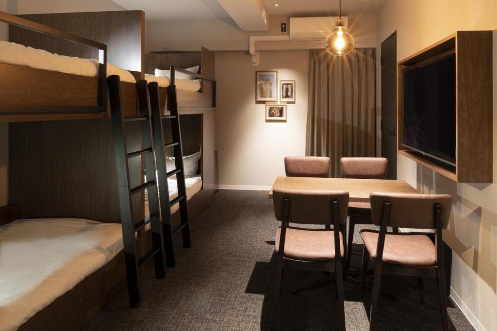 Postel nebo postele na pokoji v ubytování ALPHABED INN 小樽駅前