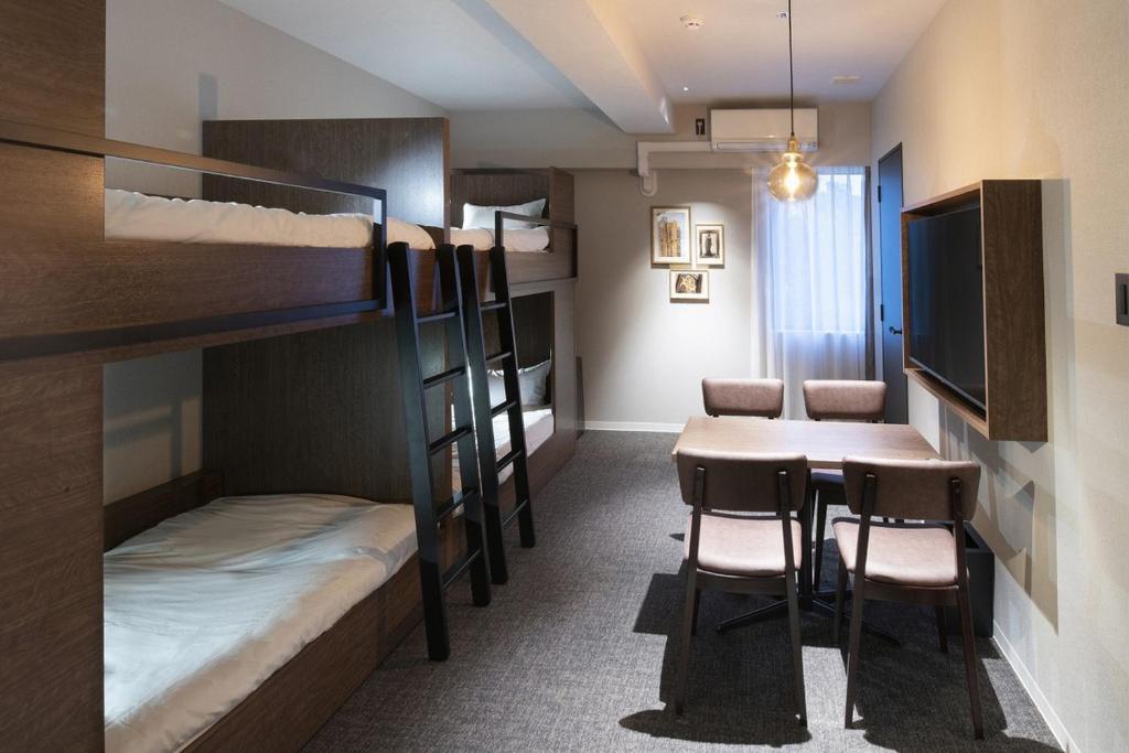 Postel nebo postele na pokoji v ubytování ALPHABED INN 小樽駅前