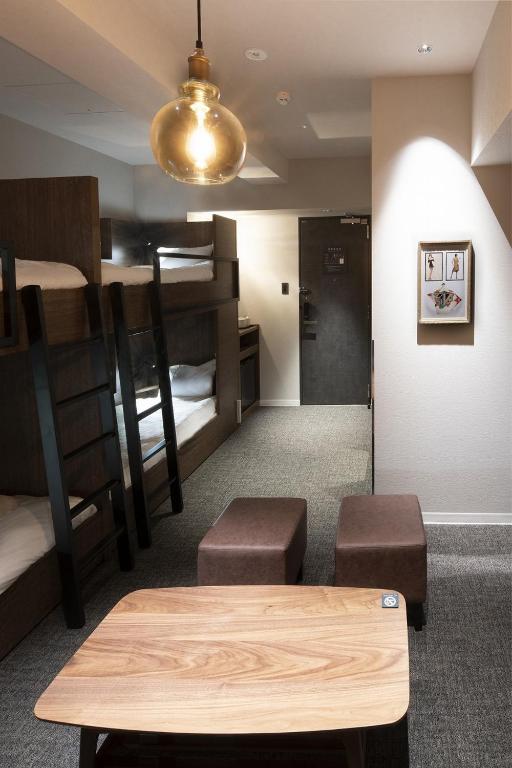 Postel nebo postele na pokoji v ubytování ALPHABED INN 小樽駅前