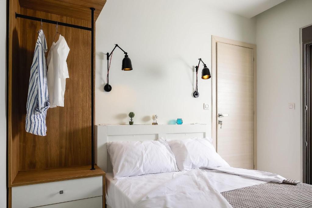 Posteľ alebo postele v izbe v ubytovaní Kipos Suites & Apartments