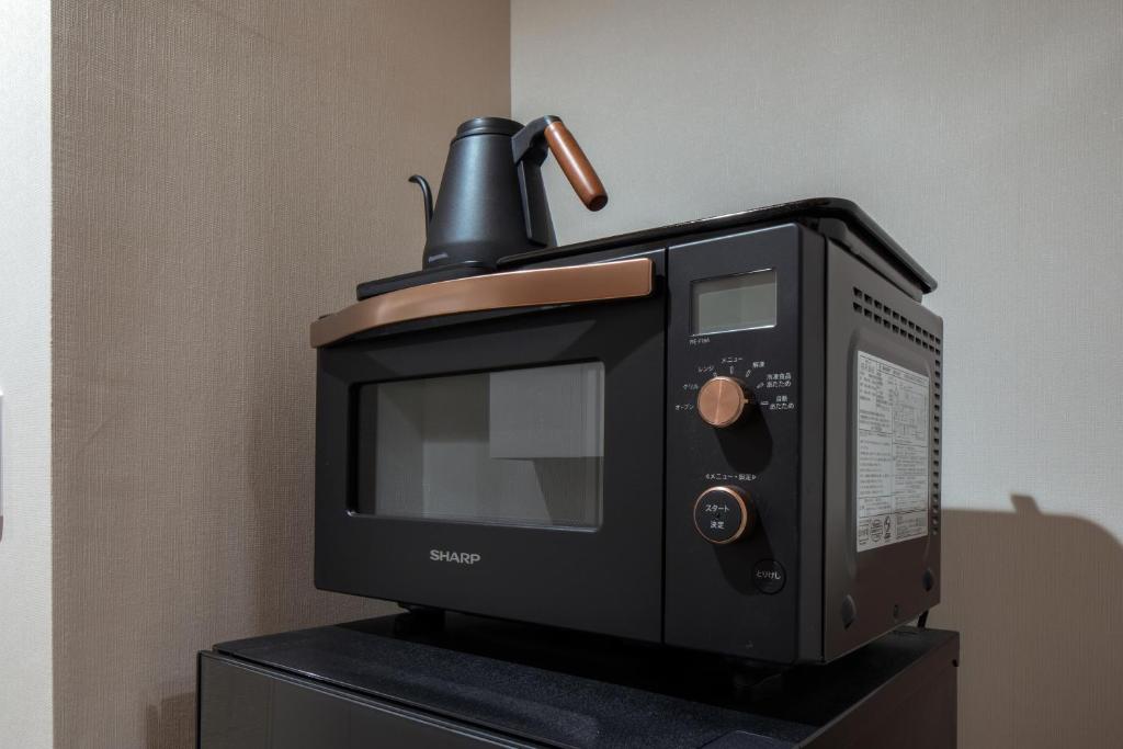 Kuchyň nebo kuchyňský kout v ubytování Randor Residence Hiroshima Suites
