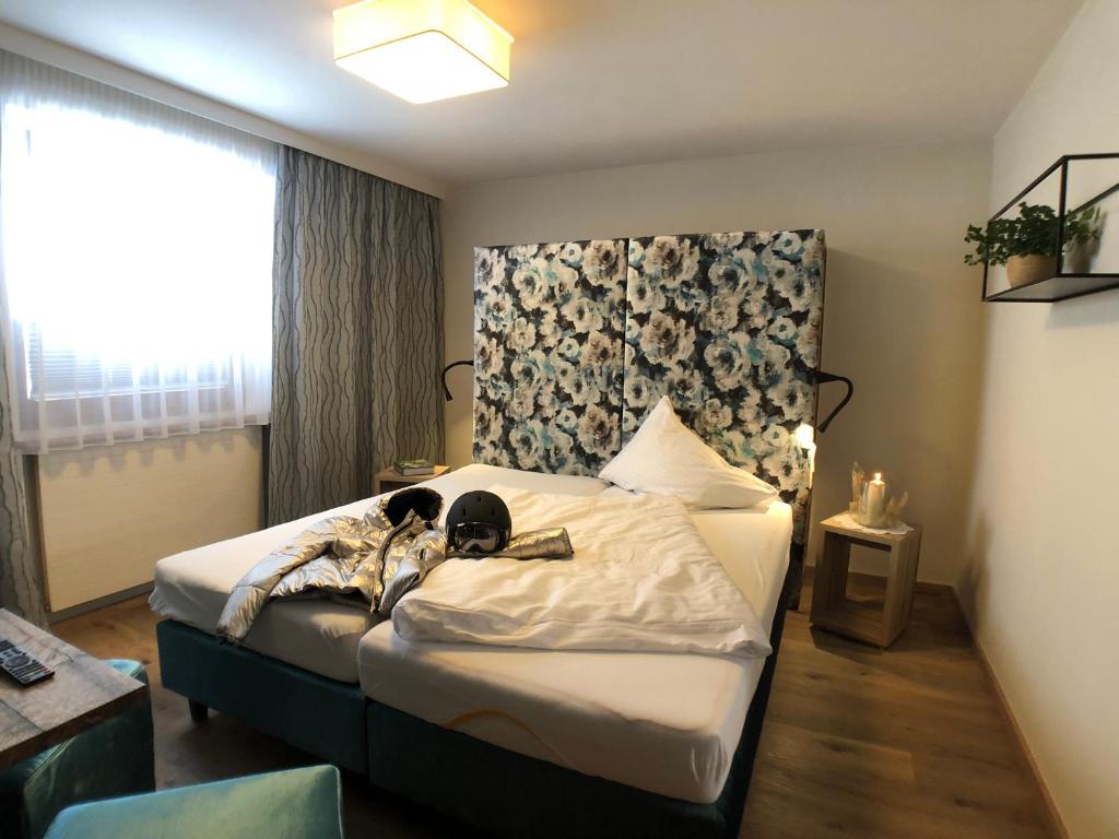 Postel nebo postele na pokoji v ubytování Hotel Alpenblick