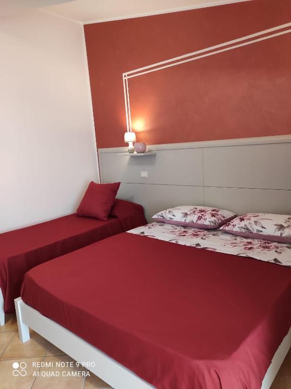 Łóżko lub łóżka w pokoju w obiekcie Casette Tulipano