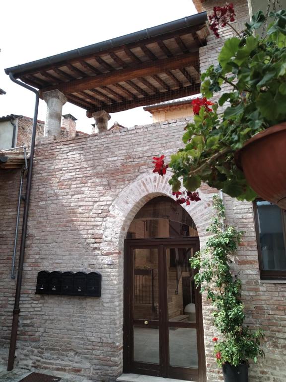 an entrance to a brick building with an archway at Il Borghetto Medievale in Fabriano
