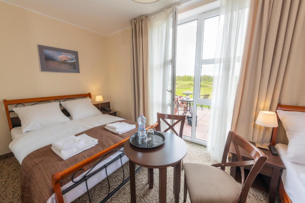 Posteľ alebo postele v izbe v ubytovaní Hotel Mona Lisa Wellness & Spa
