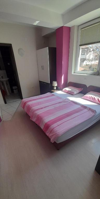 Postel nebo postele na pokoji v ubytování POP MARKOV