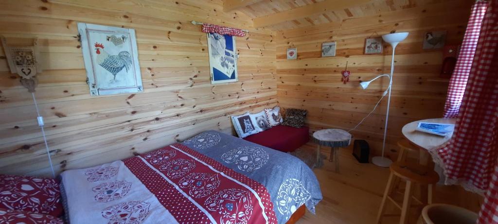 Postel nebo postele na pokoji v ubytování le mas de CHENIER