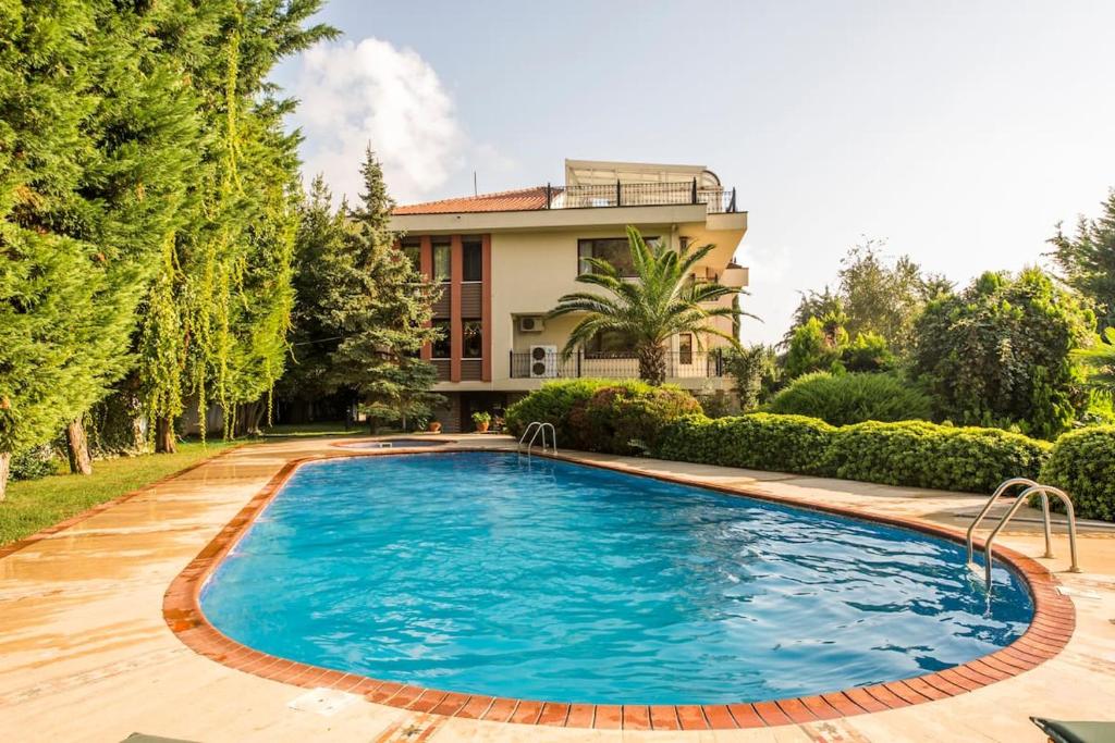 a swimming pool in front of a house at Villa Bosphorus in Istanbul