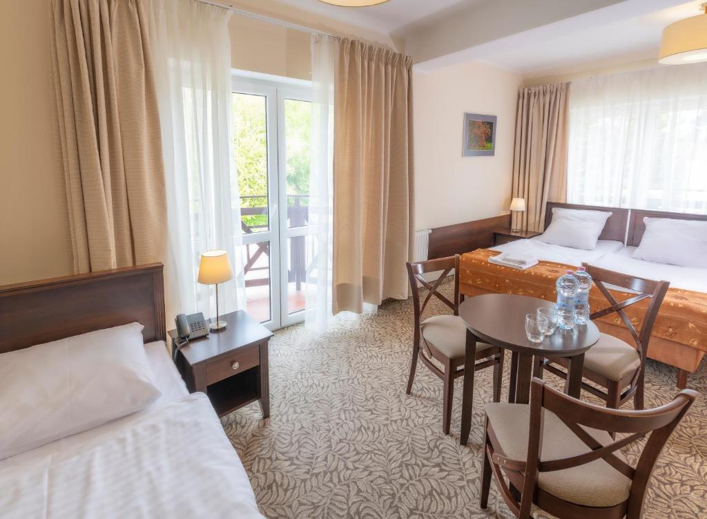 Posteľ alebo postele v izbe v ubytovaní Hotel Mona Lisa Wellness & Spa