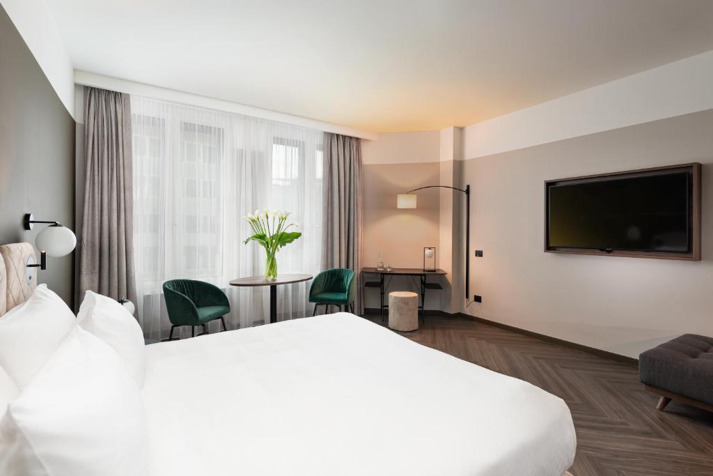 Postel nebo postele na pokoji v ubytování Hotel Tocq
