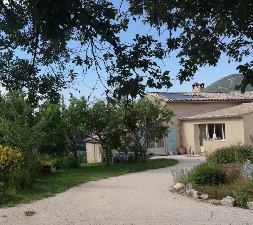 a house with a driveway in front of it at La Farigoule in Montbrun-les-Bains