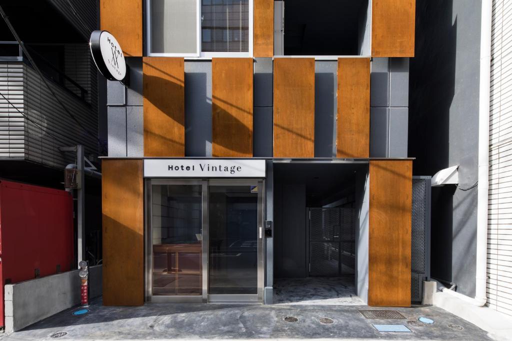 an entrance to a building with a sign that reads indian village at Hotel Vintage Tokyo in Tokyo