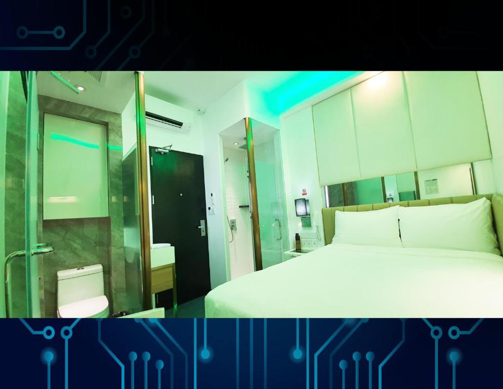 Postel nebo postele na pokoji v ubytování iOtel Luxury Kiosk Hotel