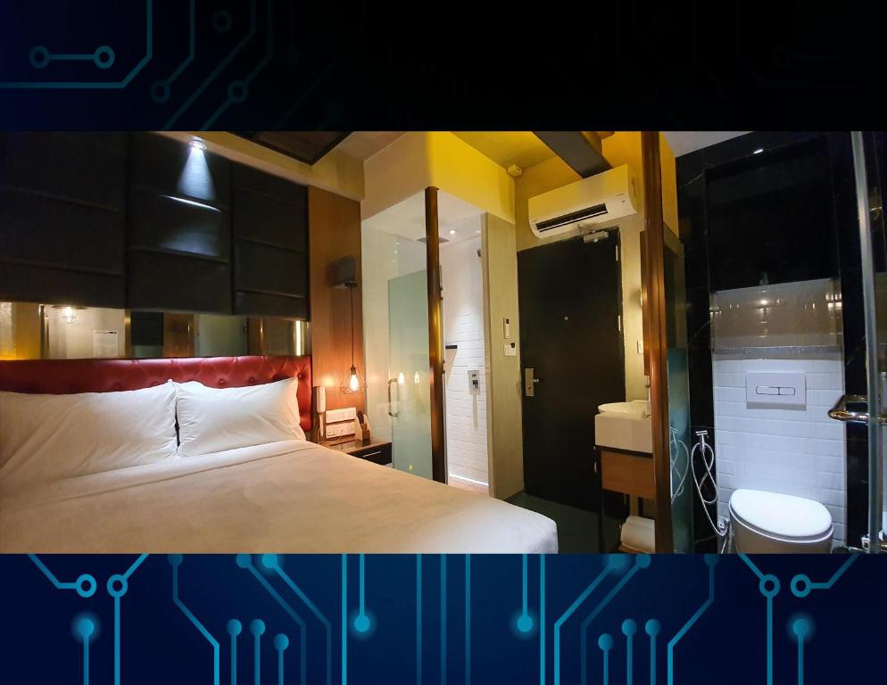 Postel nebo postele na pokoji v ubytování iOtel Luxury Kiosk Hotel