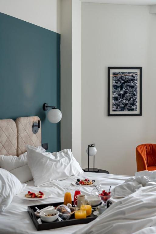 Postel nebo postele na pokoji v ubytování Hotel Tocq