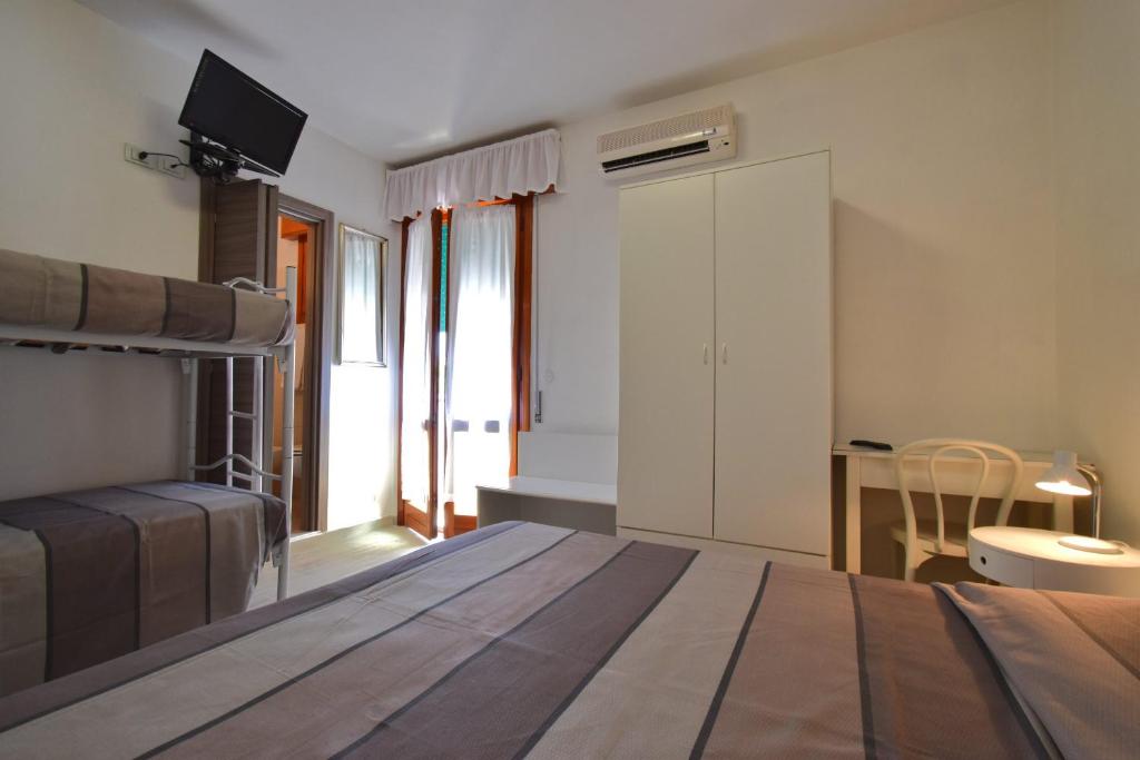Postel nebo postele na pokoji v ubytování Hotel Zanin