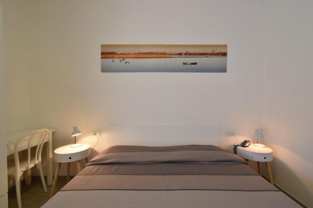 Postel nebo postele na pokoji v ubytování Hotel Zanin