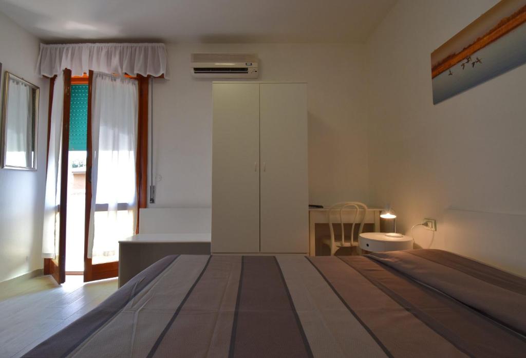 Postel nebo postele na pokoji v ubytování Hotel Zanin