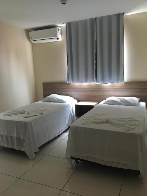 Postel nebo postele na pokoji v ubytování Ilha Bela Hotel