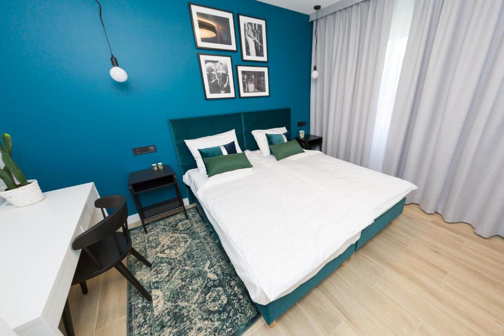 Posteľ alebo postele v izbe v ubytovaní Apartament Kołobrzeg Quattro