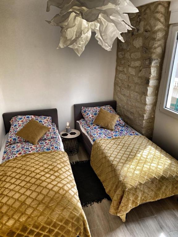 Postel nebo postele na pokoji v ubytování Apartamenty Toledo