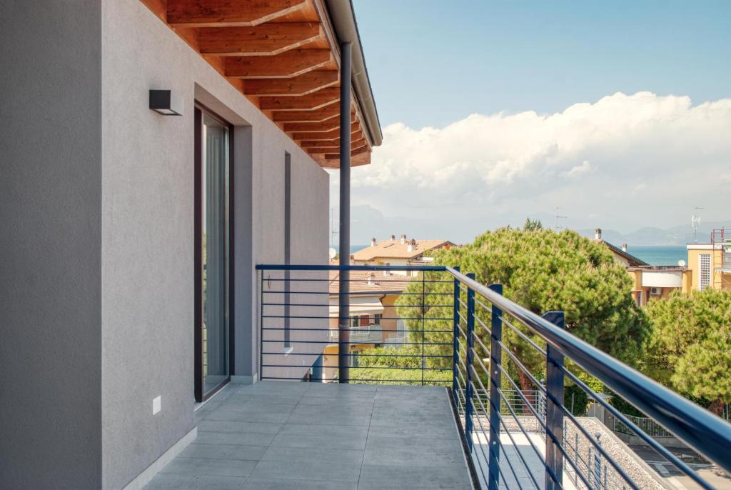 a balcony with a view of a building at Residenza Puoti in Peschiera del Garda