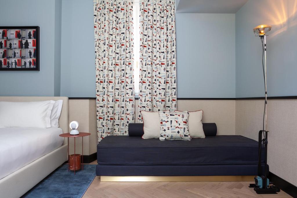 Postel nebo postele na pokoji v ubytování Amabilia Suites